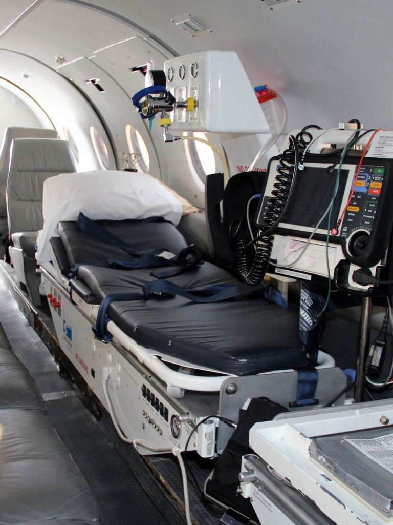 SkyCare medical transport aircraft equipped with a stretcher and patient monitoring equipment