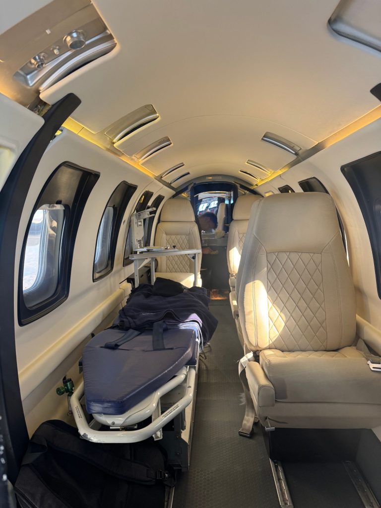 SkyCare medical transport aircraft interior configured with a patient stretcher