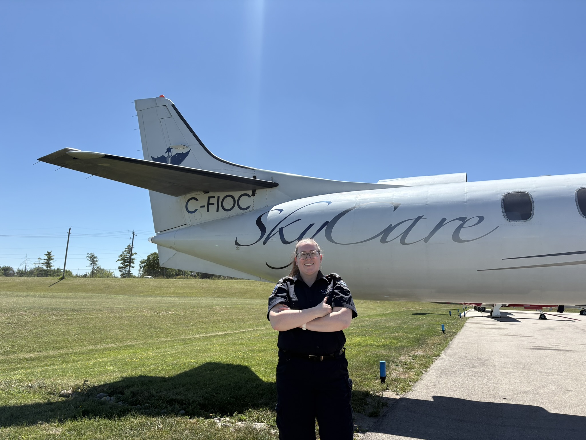 SkyCare flight paramedic standing beside a medevac aircraft