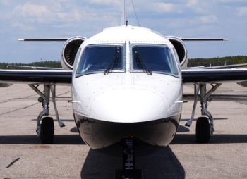 SkyCare Westwind jet parked on the apron